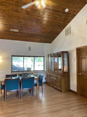 5918 Park Ridge Rd, Loves Park, IL 61111 - dining area featuring wooden ceiling, a ceiling fan, high vaulted ceiling, and light wood-style flooring