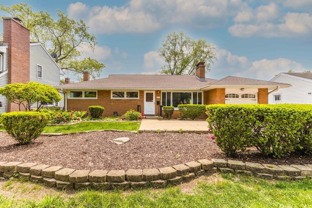 1011 Pendleton Pl, Mount Prospect, IL 60056 - ranch-style home with a chimney, brick siding, and an attached garage