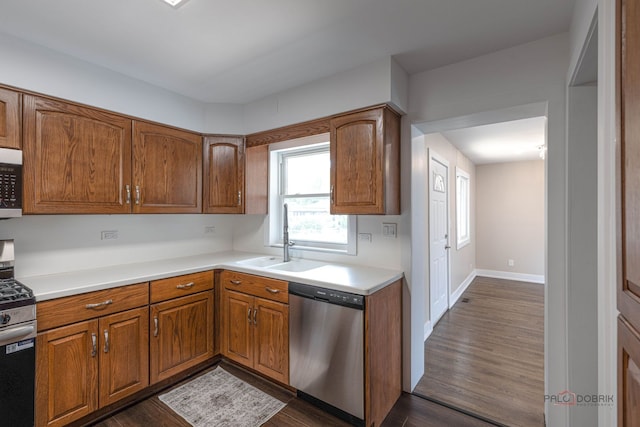 1011 Pendleton Pl, Mount Prospect, IL 60056 - kitchen with stainless steel appliances, brown cabinets, dark wood-style floors, and light countertops