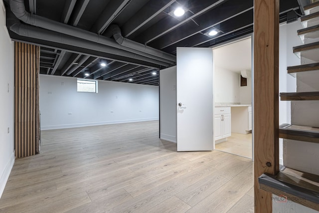 1011 Pendleton Pl, Mount Prospect, IL 60056 - below grade area featuring light wood finished floors and stairway