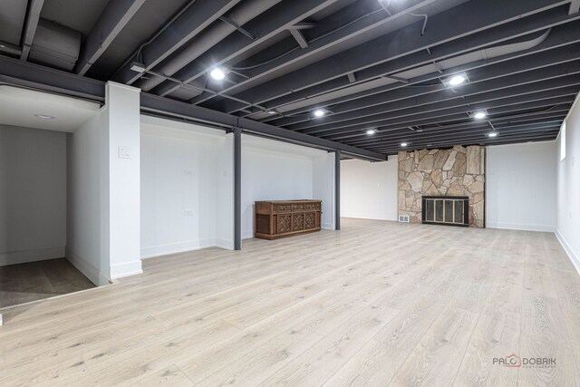 1011 Pendleton Pl, Mount Prospect, IL 60056 - finished basement with wood finished floors and a fireplace