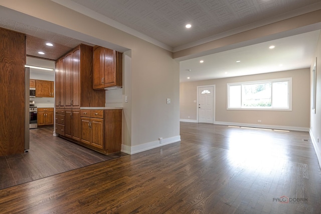 1011 Pendleton Pl, Mount Prospect, IL 60056 - kitchen featuring appliances with stainless steel finishes, brown cabinetry, dark wood finished floors, recessed lighting, and light countertops
