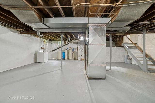 2S234 Harter Rd, Elburn, IL 60119 - unfinished basement featuring stairs, heating unit, a water softener system, and washing machine and dryer