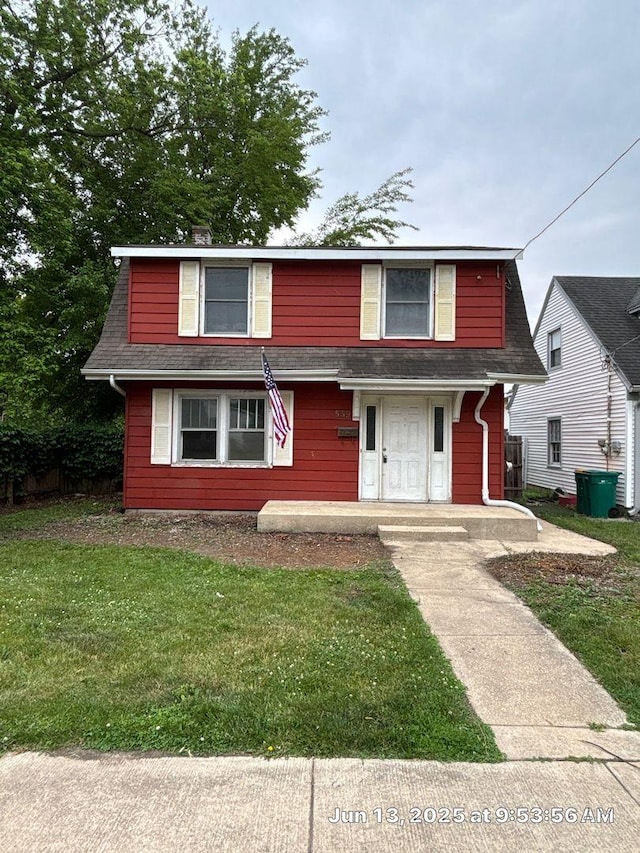 559 E 13th St, Lockport, IL 60441 - view of front of home with a front lawn and roof with shingles