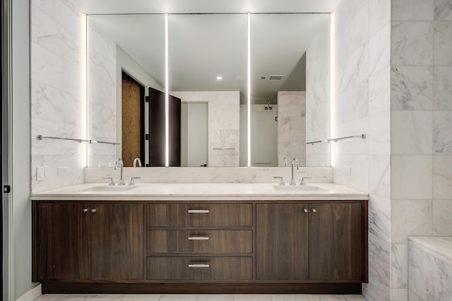 1550 N Clark St Unit 302, Chicago, IL 60610 - bathroom featuring tile walls, double vanity, and a shower