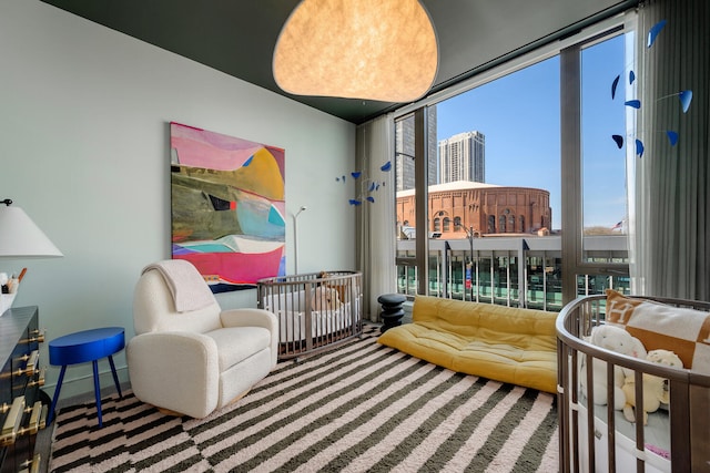 1550 N Clark St Unit 302, Chicago, IL 60610 - sitting room with carpet, a city view, and floor to ceiling windows