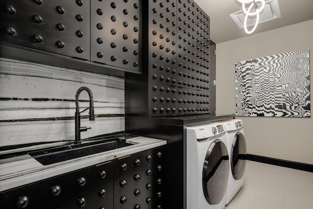 1550 N Clark St Unit 302, Chicago, IL 60610 - laundry room featuring washer and clothes dryer and cabinet space
