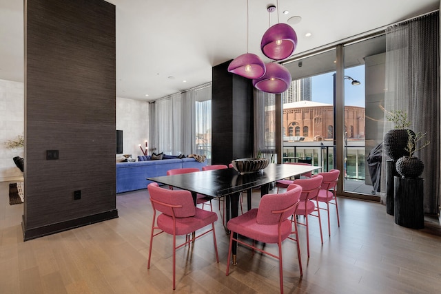 1550 N Clark St Unit 302, Chicago, IL 60610 - dining space featuring a wall of windows, light wood-type flooring, and recessed lighting
