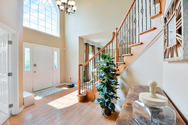 40 Open Pkwy N, Hawthorn Woods, IL 60047 - entryway with a towering ceiling, a chandelier, hardwood / wood-style floors, and stairs