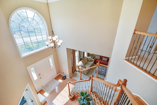 40 Open Pkwy N, Hawthorn Woods, IL 60047 - foyer with a high ceiling, a chandelier, stairs, and wood finished floors