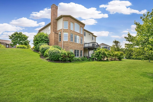 40 Open Pkwy N, Hawthorn Woods, IL 60047 - back of house with a lawn, a chimney, and brick siding