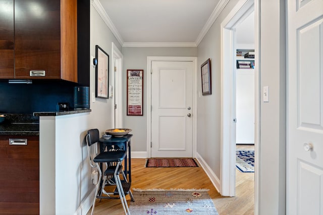 2950 W Cortland St Unit 2, Chicago, IL 60647 - foyer entrance featuring light wood finished floors and ornamental molding