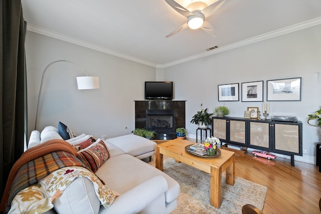2950 W Cortland St Unit 2, Chicago, IL 60647 - living room with crown molding, wood finished floors, ceiling fan, and a fireplace