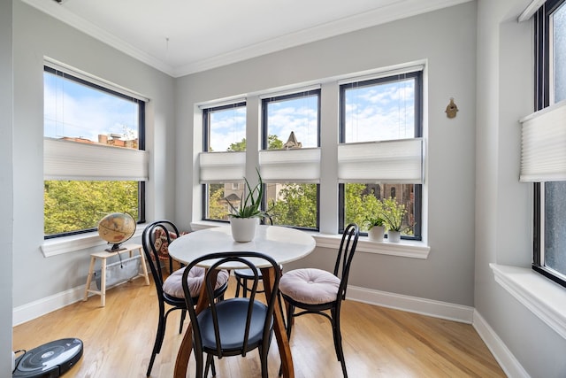 2950 W Cortland St Unit 2, Chicago, IL 60647 - dining room with light wood-style floors, healthy amount of natural light, and ornamental molding