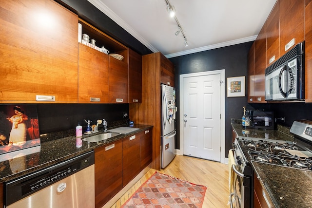 2950 W Cortland St Unit 2, Chicago, IL 60647 - kitchen featuring stainless steel appliances, light wood finished floors, track lighting, open shelves, and ornamental molding