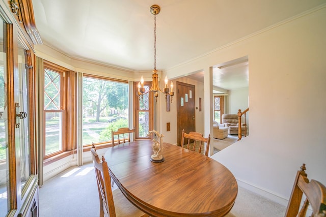 3009 N 78th Ct, Elmwood Park, IL 60707 - dining room featuring light colored carpet, a chandelier, and ornamental molding