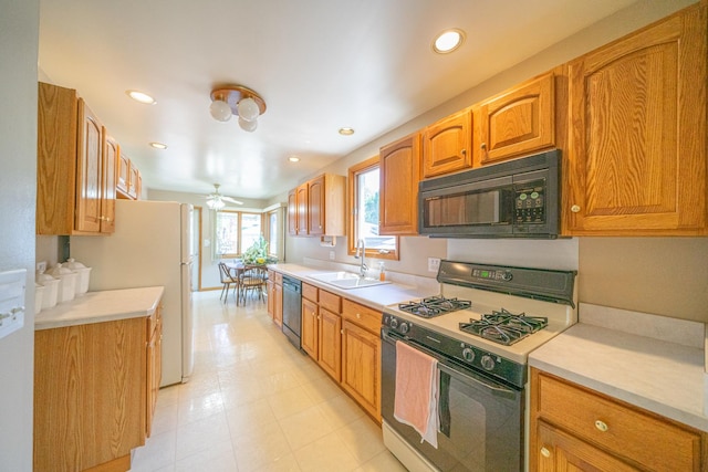 3009 N 78th Ct, Elmwood Park, IL 60707 - kitchen featuring gas stove, black microwave, dishwasher, light countertops, and recessed lighting
