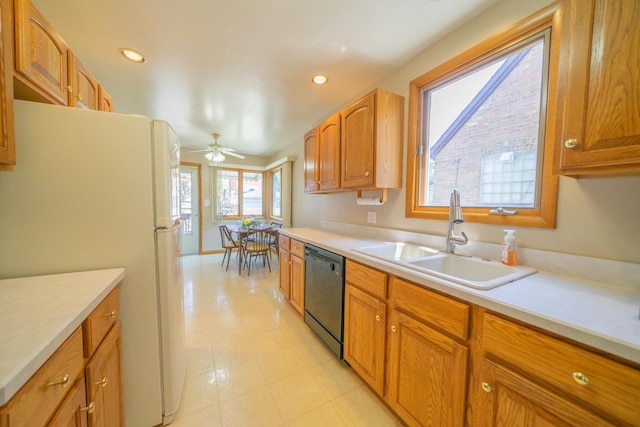 3009 N 78th Ct, Elmwood Park, IL 60707 - kitchen with dishwasher, freestanding refrigerator, light countertops, ceiling fan, and brown cabinetry