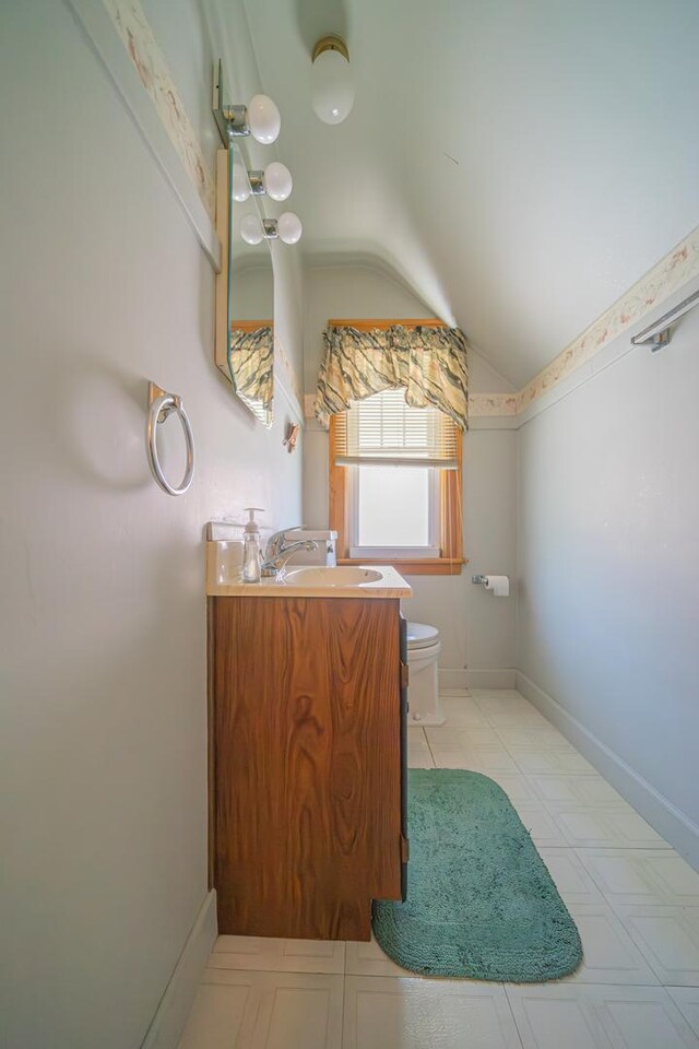 3009 N 78th Ct, Elmwood Park, IL 60707 - bathroom with lofted ceiling and vanity