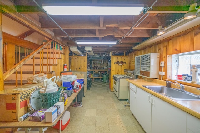 3009 N 78th Ct, Elmwood Park, IL 60707 - basement with wooden walls, light flooring, and a workshop area