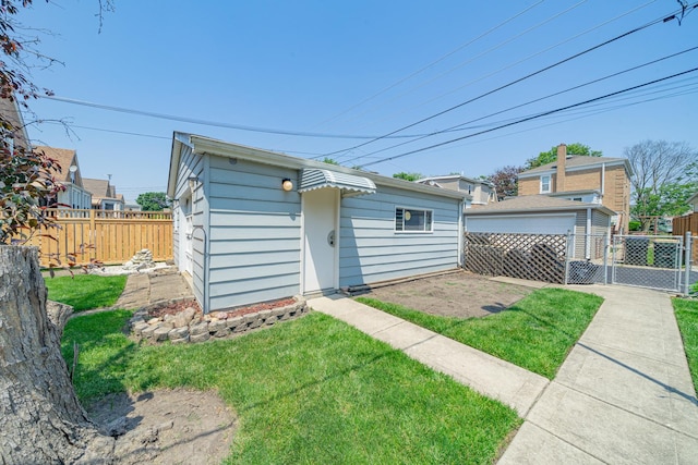 3009 N 78th Ct, Elmwood Park, IL 60707 - back of property featuring a gate and an outbuilding