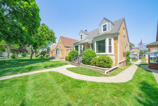 3009 N 78th Ct, Elmwood Park, IL 60707 - view of front of house with a front yard, brick siding, and roof with shingles