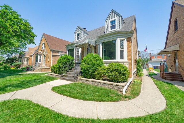 3009 N 78th Ct, Elmwood Park, IL 60707 - view of front of house featuring a shingled roof, a front lawn, and brick siding