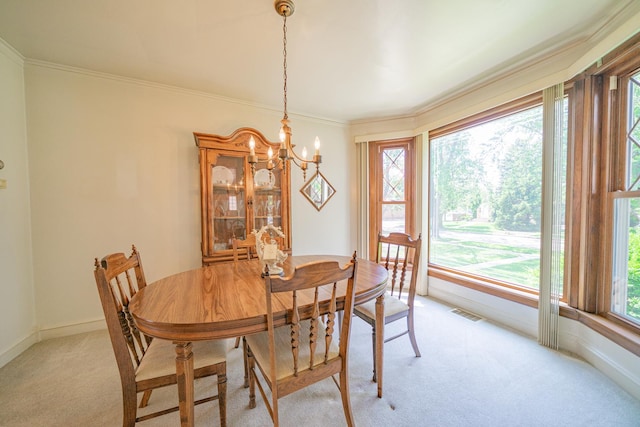 3009 N 78th Ct, Elmwood Park, IL 60707 - dining space with light colored carpet, a chandelier, and ornamental molding