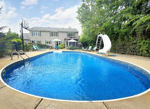 731 Queens Gate Cir, Sugar Grove, IL 60554 - view of swimming pool with a water slide and a patio area