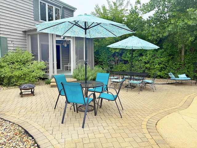 731 Queens Gate Cir, Sugar Grove, IL 60554 - view of patio with outdoor dining space and a fire pit