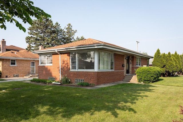 7356 N Nora Ave, Niles, IL 60714 - bungalow-style house featuring brick siding, a front lawn, and a chimney