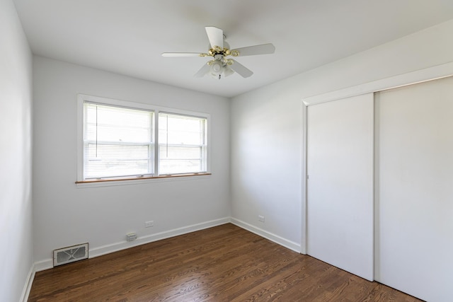 7356 N Nora Ave, Niles, IL 60714 - unfurnished bedroom with wood finished floors, a closet, and ceiling fan