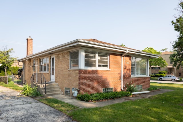 7356 N Nora Ave, Niles, IL 60714 - view of side of home featuring a chimney and brick siding