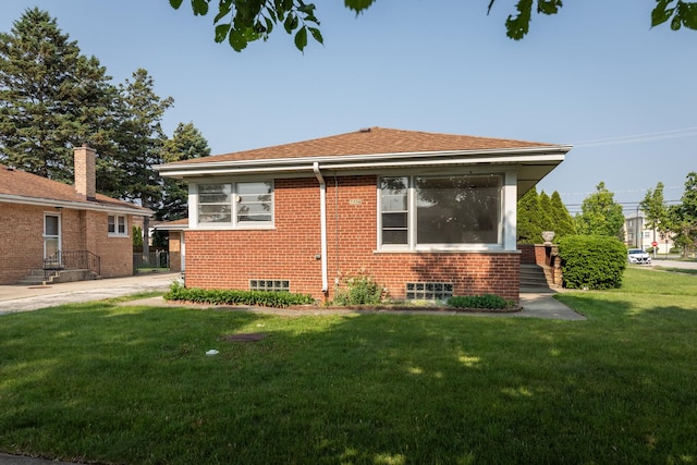 7356 N Nora Ave, Niles, IL 60714 - view of side of property featuring a lawn and brick siding