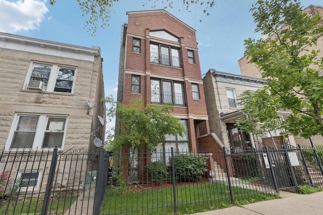 3041 N California Ave Unit 1, Chicago, IL 60618 - multi unit property featuring a fenced front yard and brick siding