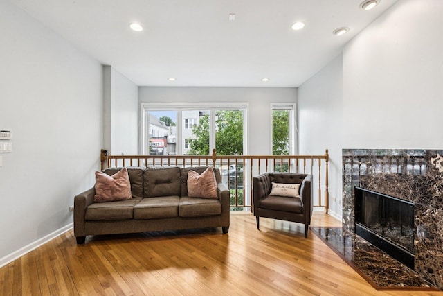 3041 N California Ave Unit 1, Chicago, IL 60618 - living room featuring light wood-style flooring, recessed lighting, and a high end fireplace