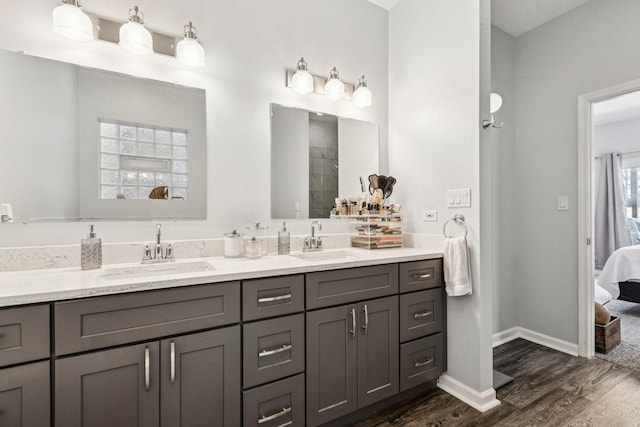 3041 N California Ave Unit 1, Chicago, IL 60618 - ensuite bathroom featuring double vanity and wood finished floors