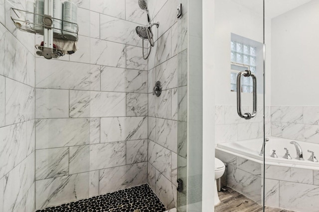3041 N California Ave Unit 1, Chicago, IL 60618 - bathroom with a garden tub, tiled shower, and wood finished floors