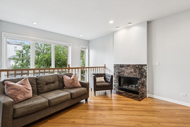3041 N California Ave Unit 1, Chicago, IL 60618 - living room featuring light wood-style flooring, recessed lighting, and a premium fireplace