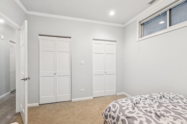 3041 N California Ave Unit 1, Chicago, IL 60618 - bedroom featuring carpet floors, multiple closets, ornamental molding, and recessed lighting