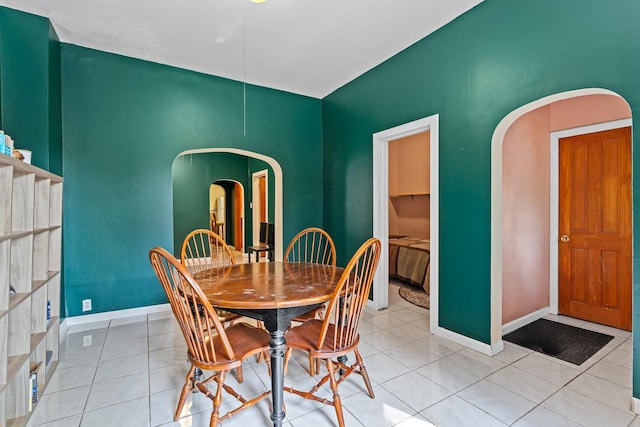 3609 S Leavitt St, Chicago, IL 60609 - dining room with arched walkways and light tile patterned floors