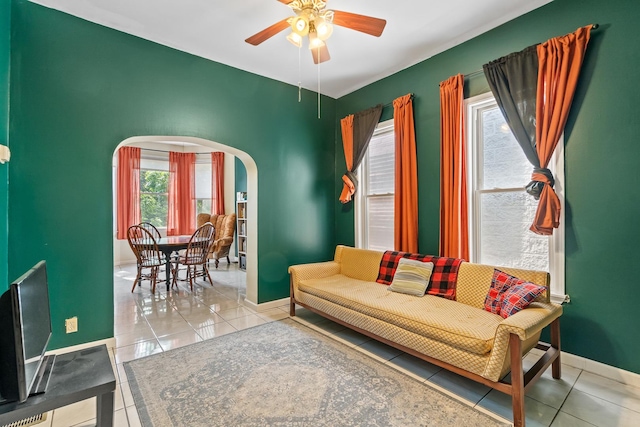 3609 S Leavitt St, Chicago, IL 60609 - living area featuring arched walkways, a ceiling fan, and tile patterned floors