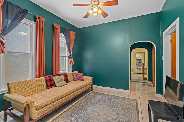 3609 S Leavitt St, Chicago, IL 60609 - living room featuring tile patterned flooring, ceiling fan, and arched walkways