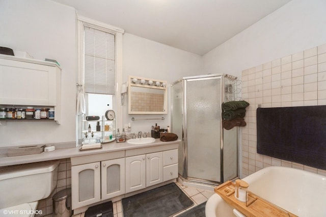 1328 W Nelson St, Chicago, IL 60657 - bathroom with vanity, a shower stall, a bathtub, and tile patterned flooring