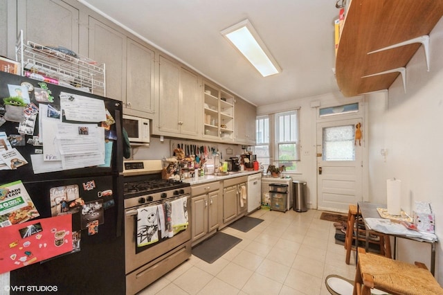 1328 W Nelson St, Chicago, IL 60657 - kitchen with white appliances, light countertops, and light tile patterned floors