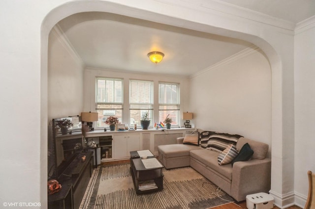 1328 W Nelson St, Chicago, IL 60657 - living room with ornamental molding, arched walkways, and wood finished floors