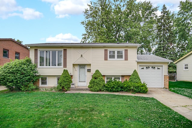 5826 Edward Dr, Oak Forest, IL 60452 - bi-level home featuring driveway, an attached garage, and a front lawn