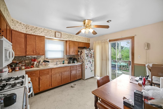 5826 Edward Dr, Oak Forest, IL 60452 - kitchen featuring white appliances, ceiling fan, and brown cabinets