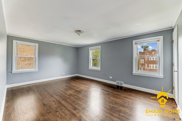 9019 S Justine St, Chicago, IL 60620 - spare room featuring ornamental molding and dark wood-type flooring