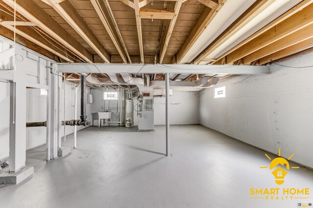 9019 S Justine St, Chicago, IL 60620 - basement with gas water heater and a sink
